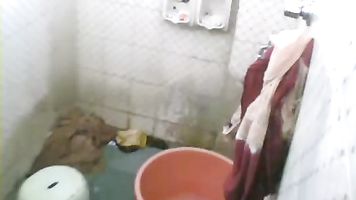 Indian housewife free from her daily household work taking shower on weekend unaware that her man fixed a hidden cam to record her hot shower. video2porn2
